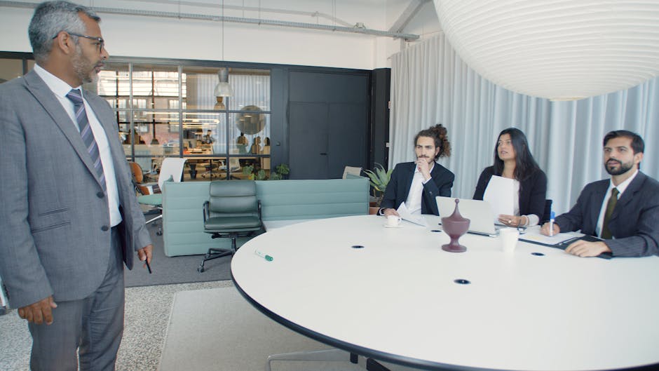 Professional business meeting with executives in a modern conference room