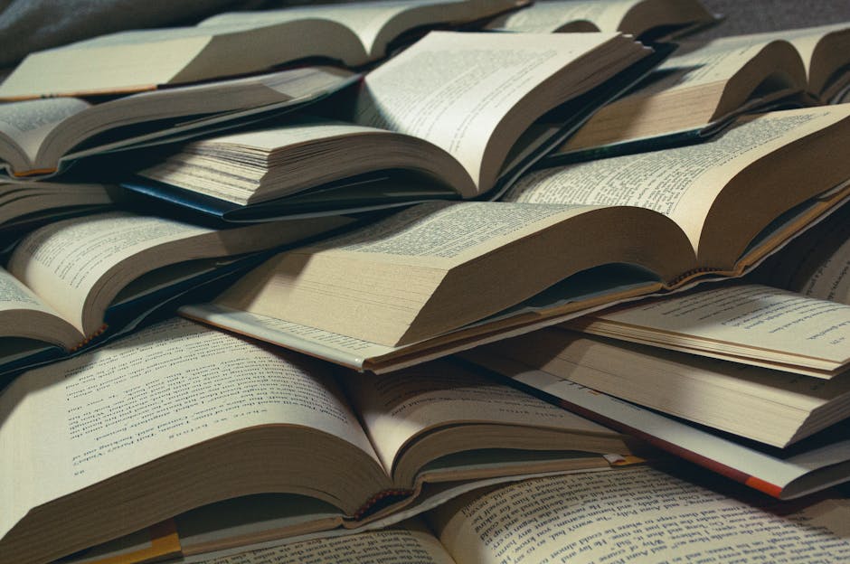 A close-up view of a pile of open books, perfect for bookworms and study sessions.